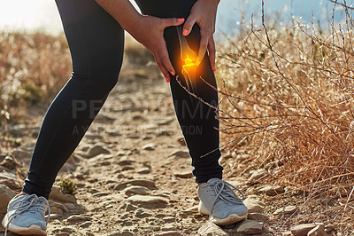 Buy stock photo Shot of an unrecognizable woman exercising outdoors with a highlighted knee injury