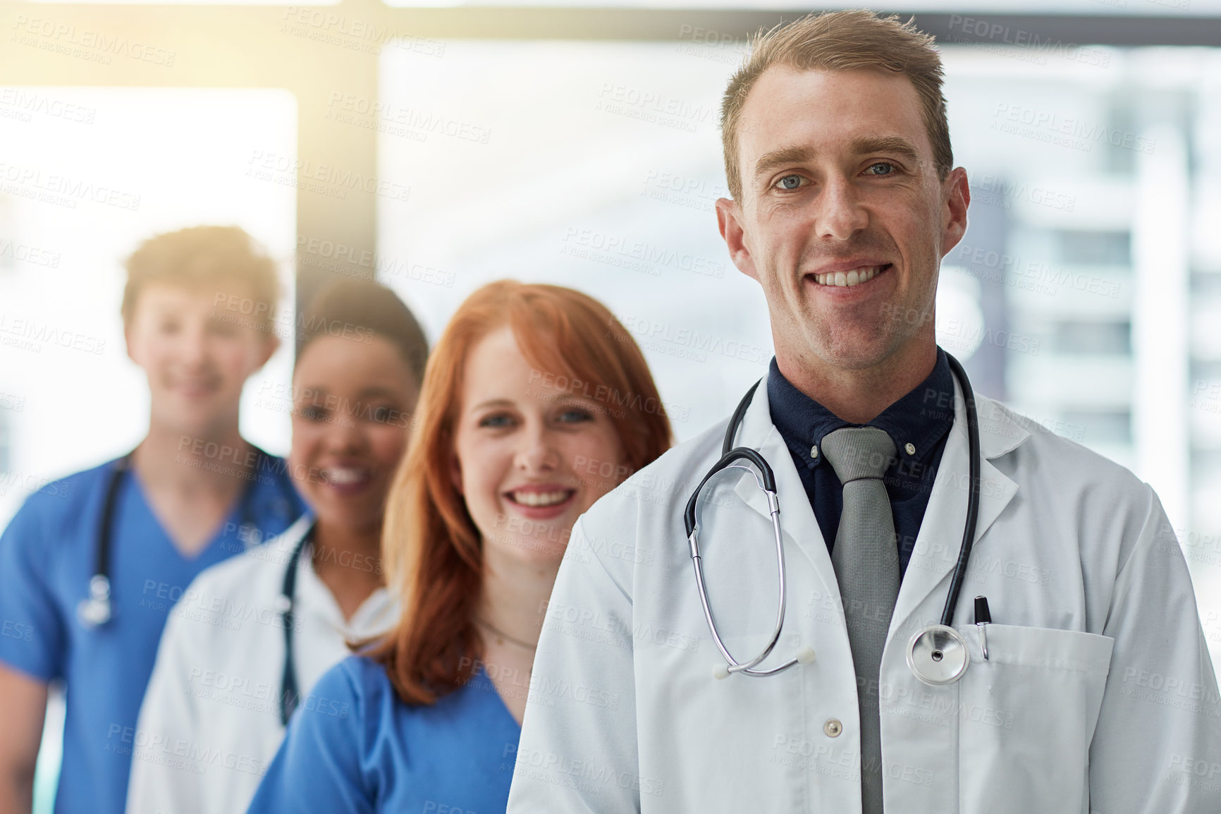 Buy stock photo Leader, portrait and medical group in hospital for career, about us or service in line at clinic. Face, happy people and healthcare team, doctors and expert professional nurses together for wellness