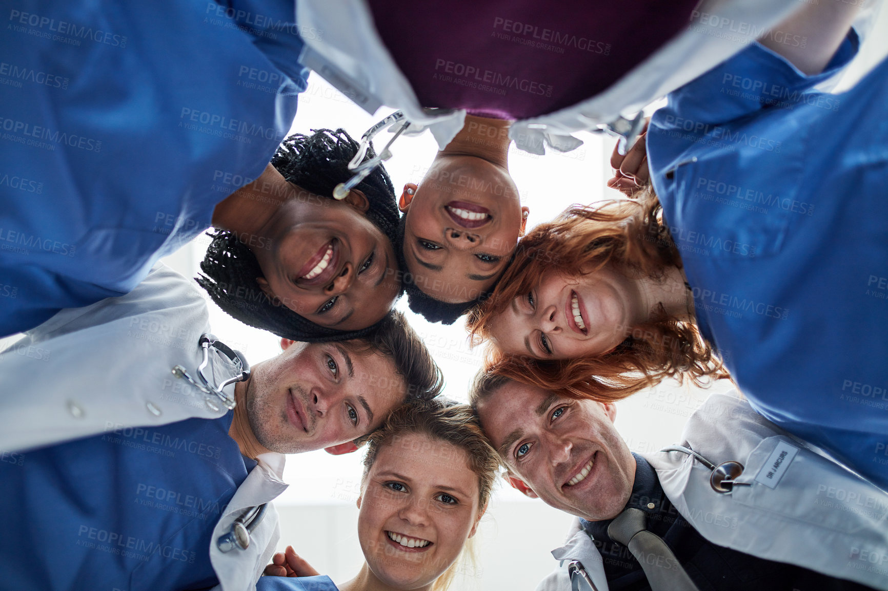 Buy stock photo Portrait, teamwork or doctors in huddle with support in collaboration for healthcare mission. Hospital, happy people and low angle of medical nurses with group solidarity, motivation or community
