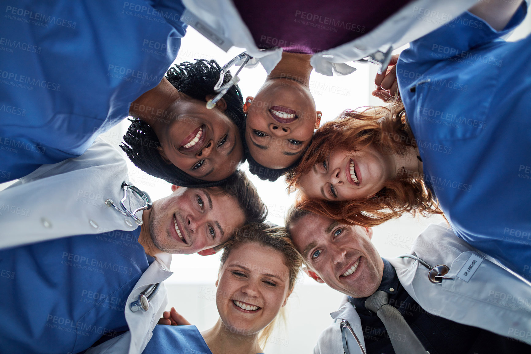 Buy stock photo Portrait, teamwork or doctors in huddle with mission in collaboration for healthcare support. Hospital, happy people and low angle of medical nurses with group solidarity, motivation or community