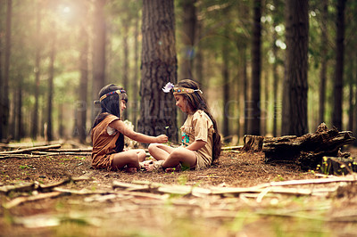 Buy stock photo Native American children, girls and woods for bonding with culture, heritage or connection in nature. Princess, siblings and happy in forest for festival or history in traditional clothes with smile