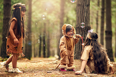 Buy stock photo Full length shot of three little girls playing dressup in the woods