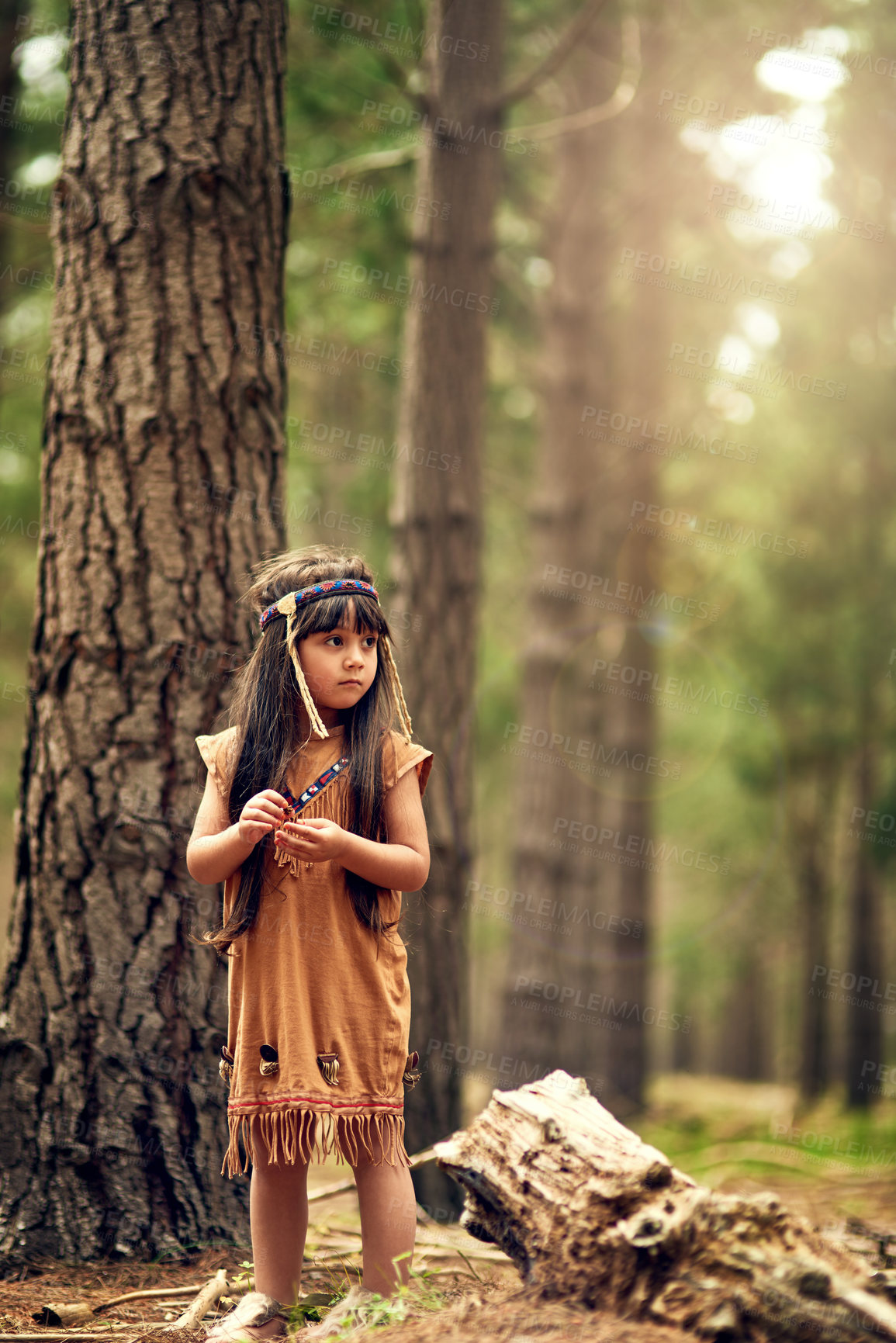 Buy stock photo Full length shot of a cute little girl playing dressup in the woods