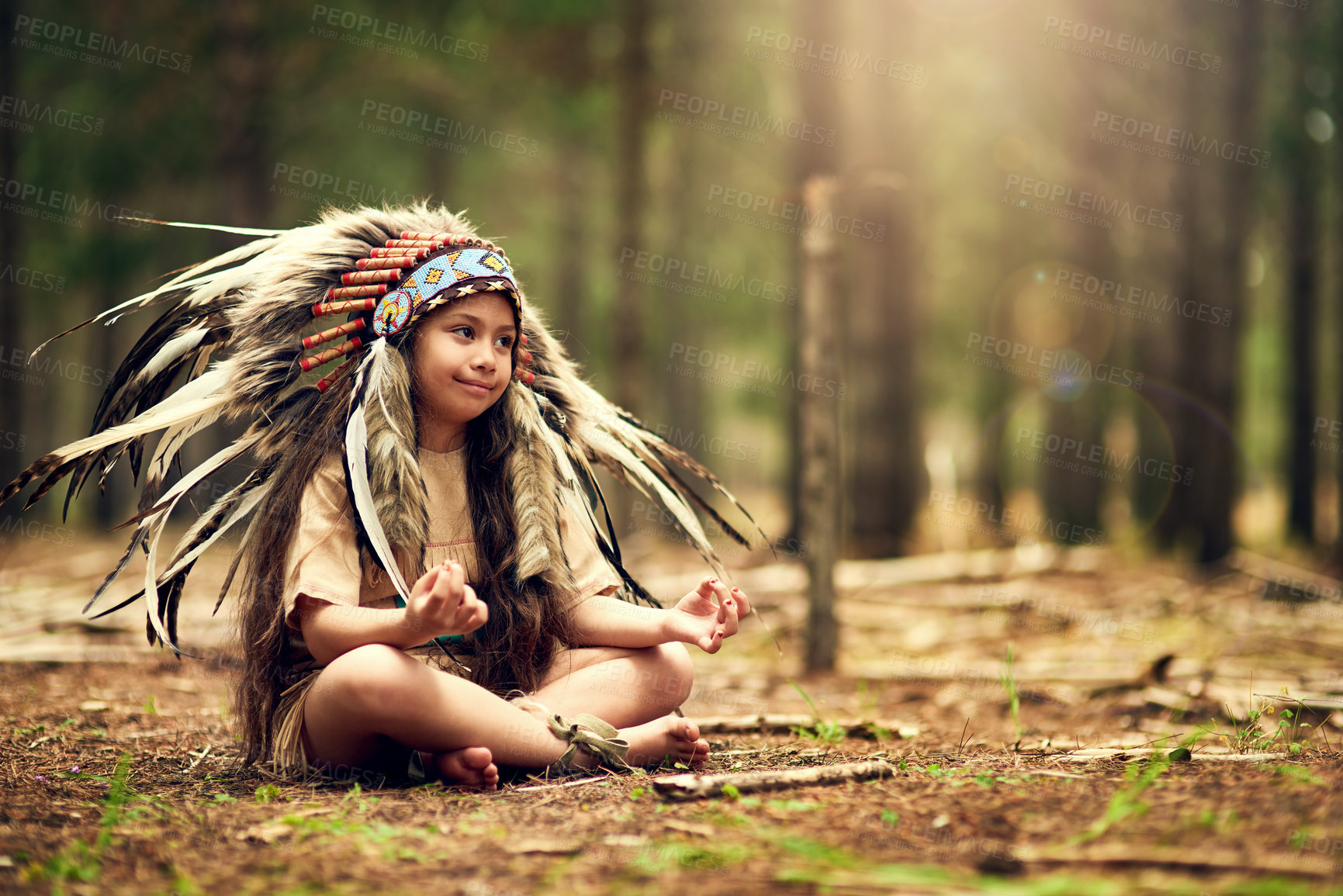 Buy stock photo Native American chief, forest and nature for meditation in childhood for connection with war bonnet in woods. Faith, girl and relax with mindfulness, peace and insight with reflection in California