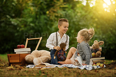 Buy stock photo Shot of a little boy and his sister out reading in the woods