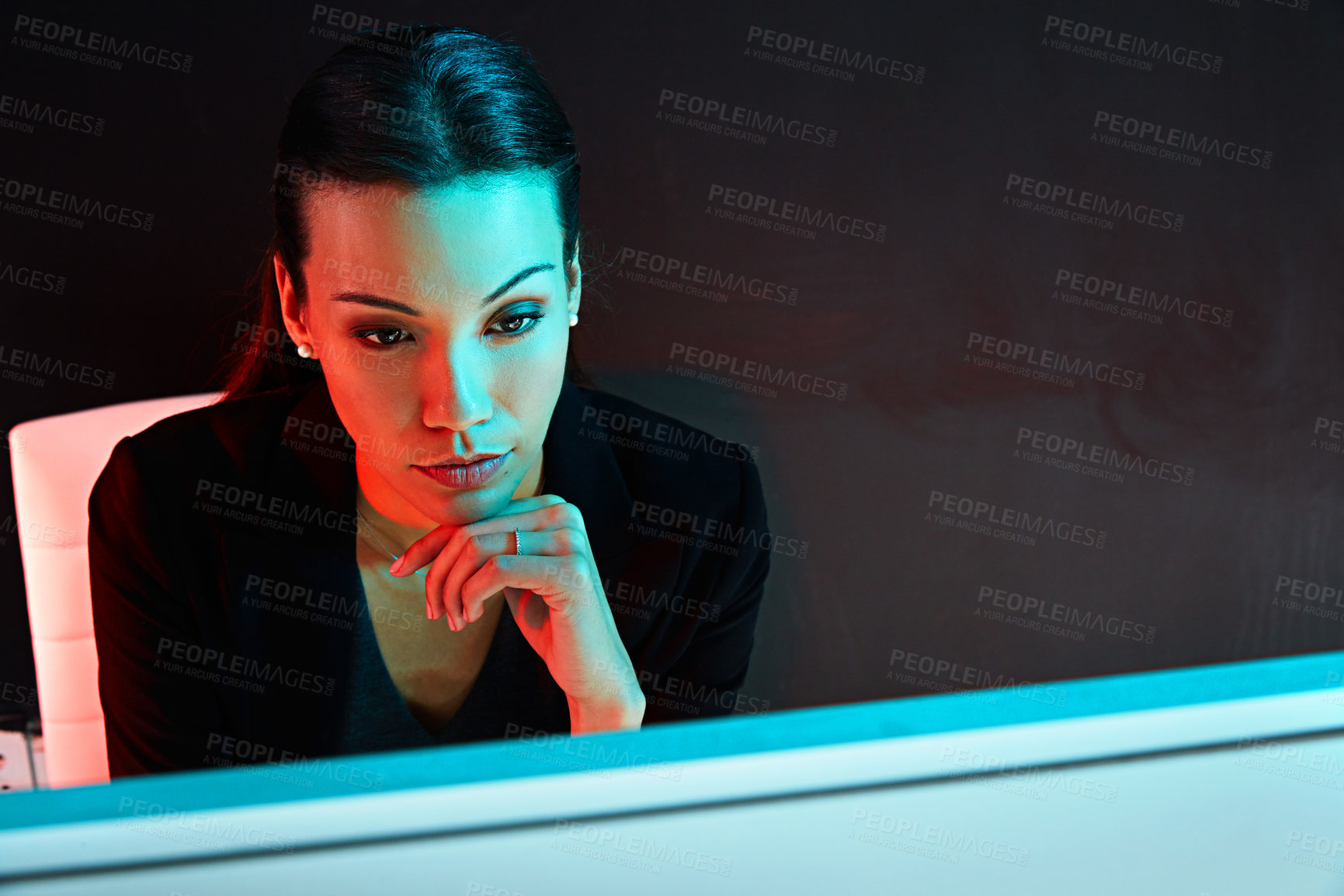 Buy stock photo Shot of a young businesswoman posing against a dark background