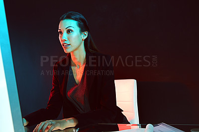 Buy stock photo Shot of a young businesswoman posing against a dark background