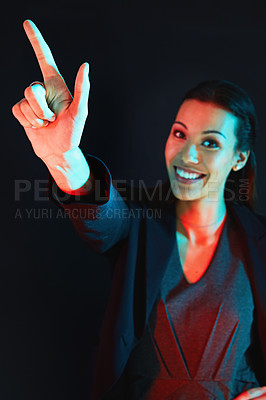 Buy stock photo Portrait of a young businesswoman showing a number with her fingers against a dark background