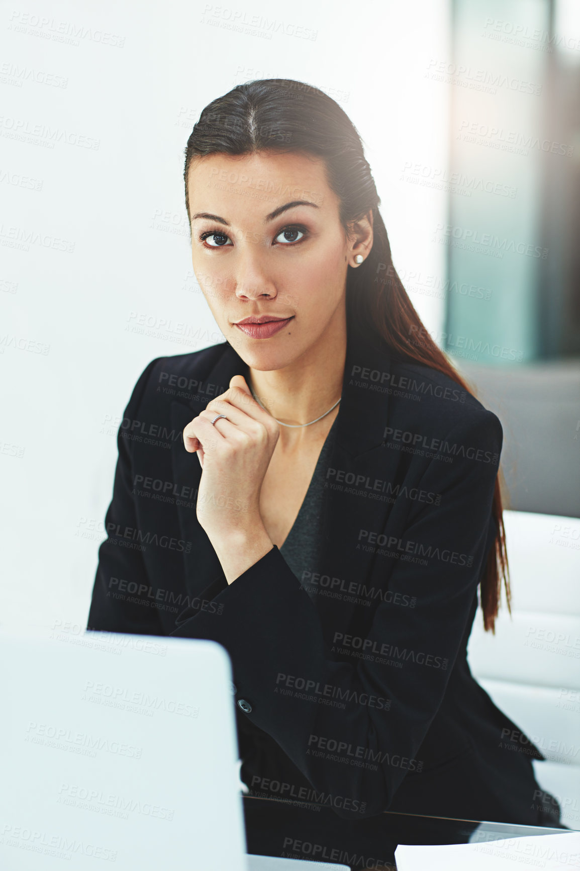 Buy stock photo Portrait of a young businesswoman working with her laptop in the office