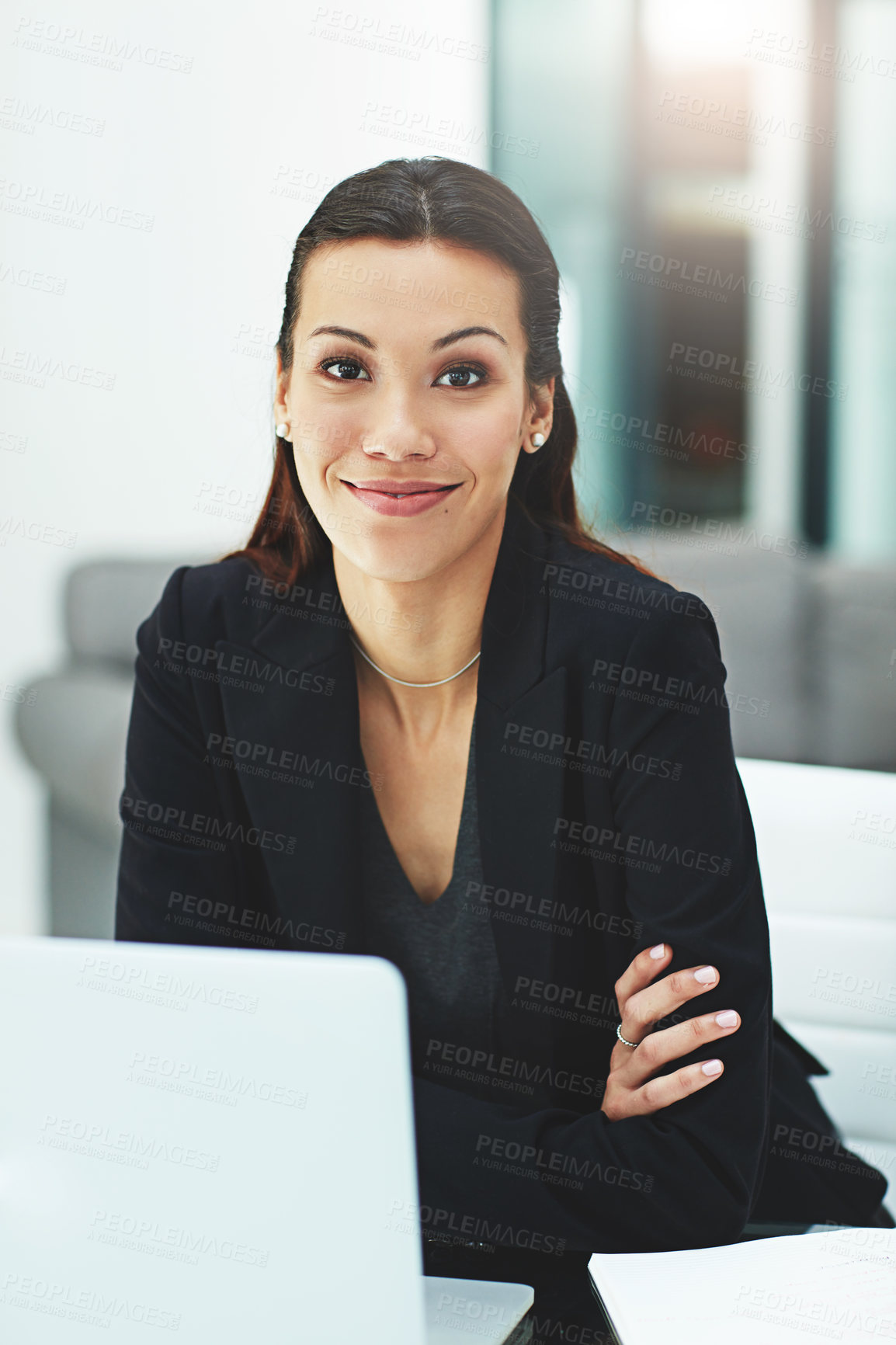 Buy stock photo Portrait of a young businesswoman working with her laptop in the office