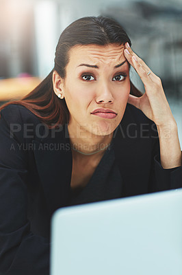 Buy stock photo Shot of a bored businesswoman looking bored at her desk