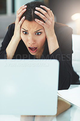 Buy stock photo Shot of a surprised businesswoman staring at her laptop in disbelief