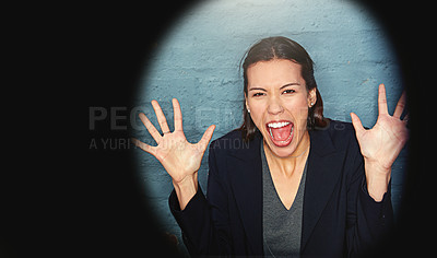 Buy stock photo Portrait of a businesswoman posing against a brick wall with a peephole effect
