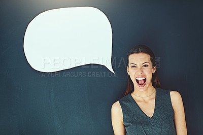 Buy stock photo Portrait of a young woman posing with a speech bubble against a gray background