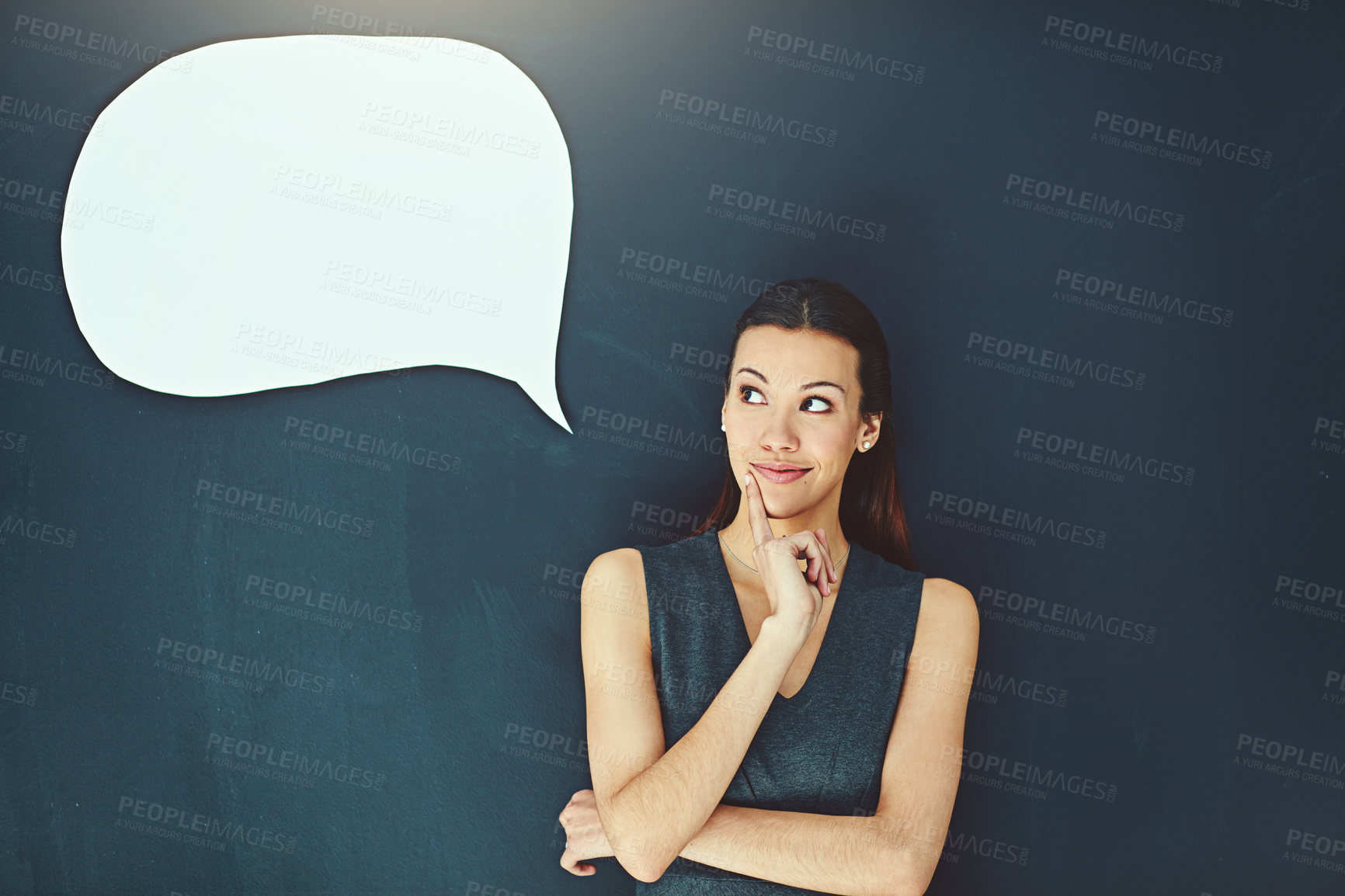 Buy stock photo Shot of a young woman posing with a speech bubble against a gray background