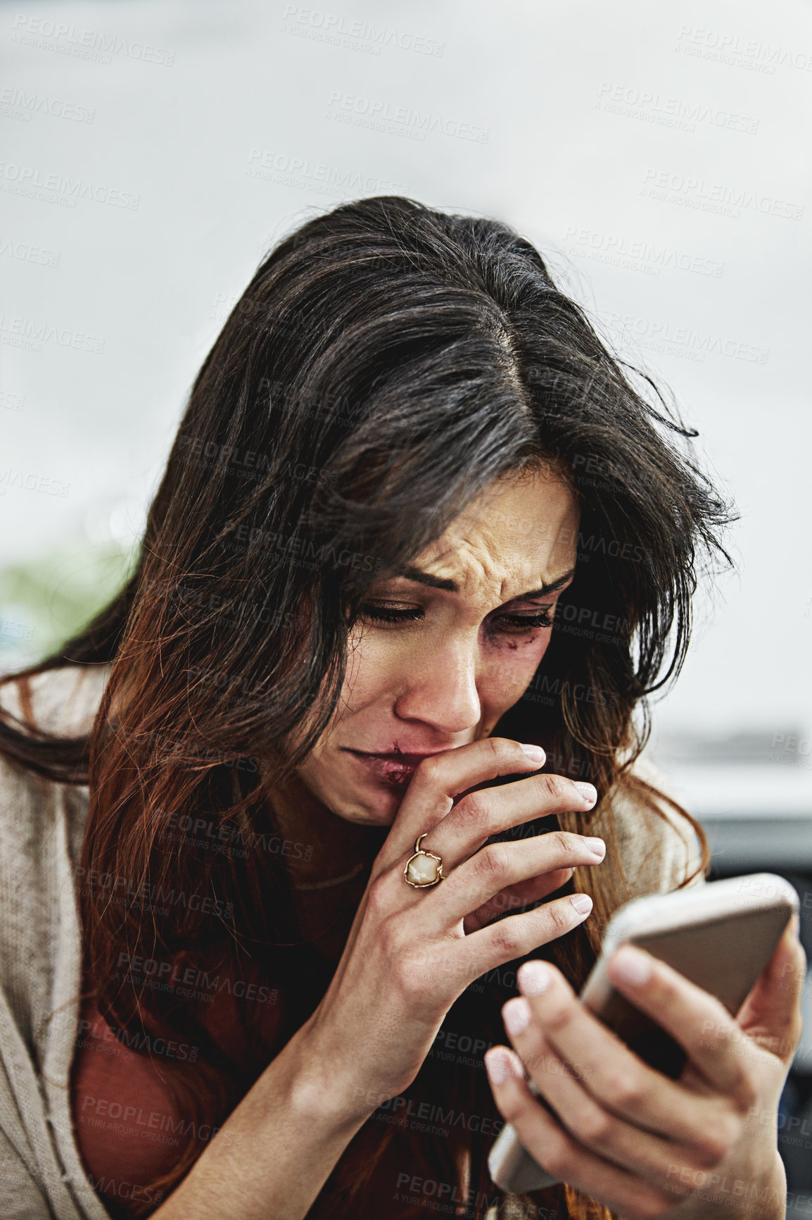 Buy stock photo Bruise, crying and woman with phone in home, domestic violence help website and online crisis support. Injured, scared and gbv victim with mobile to report abuse, sad or mental health hotline service