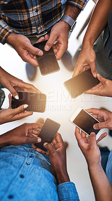 Buy stock photo Cellphone, hands and team of people in circle networking online for email, social media or internet. Technology, typing and group of friends with phone for text message on website from above.