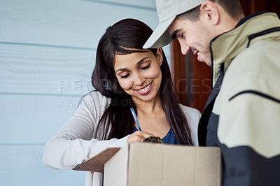 Buy stock photo Cropped shot of a young woman signing for her delivery from the courier