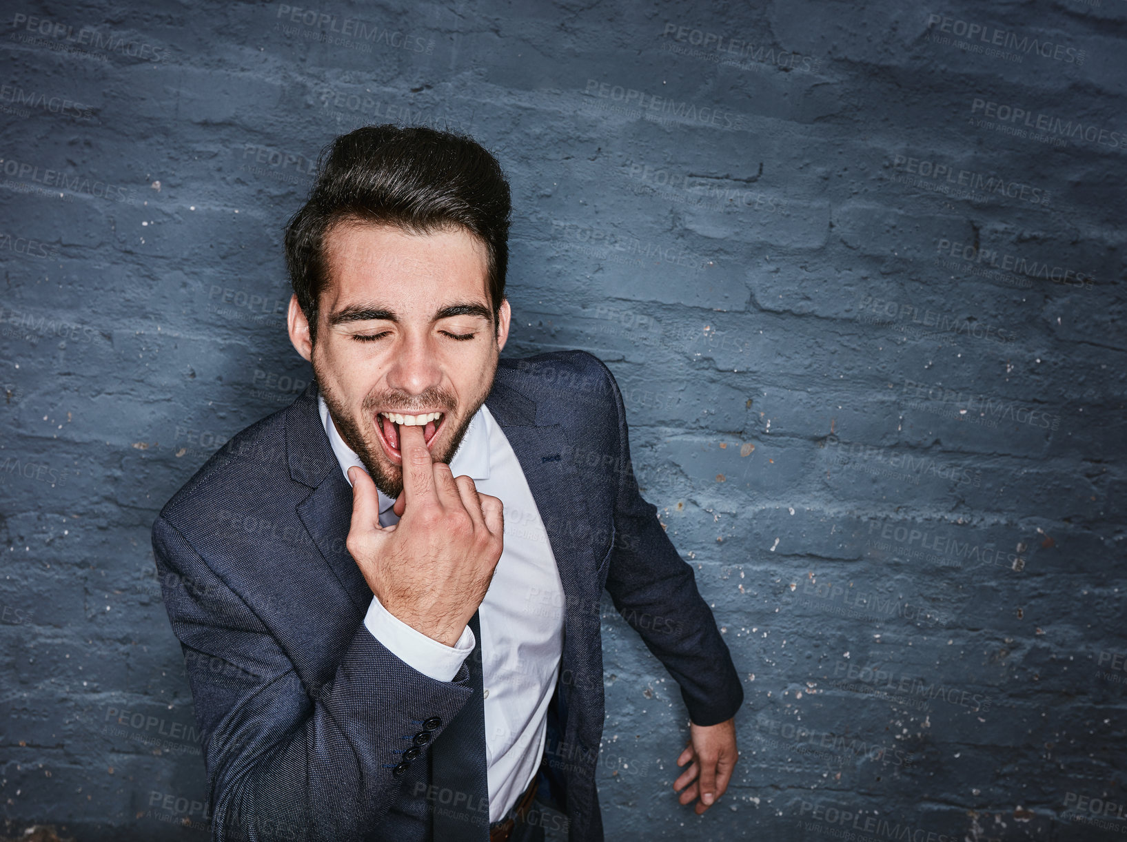 Buy stock photo Shit of a business man sticking his finger down his throat against a grey wall