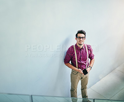 Buy stock photo High angle portrait of a handsome young designer standing in his office