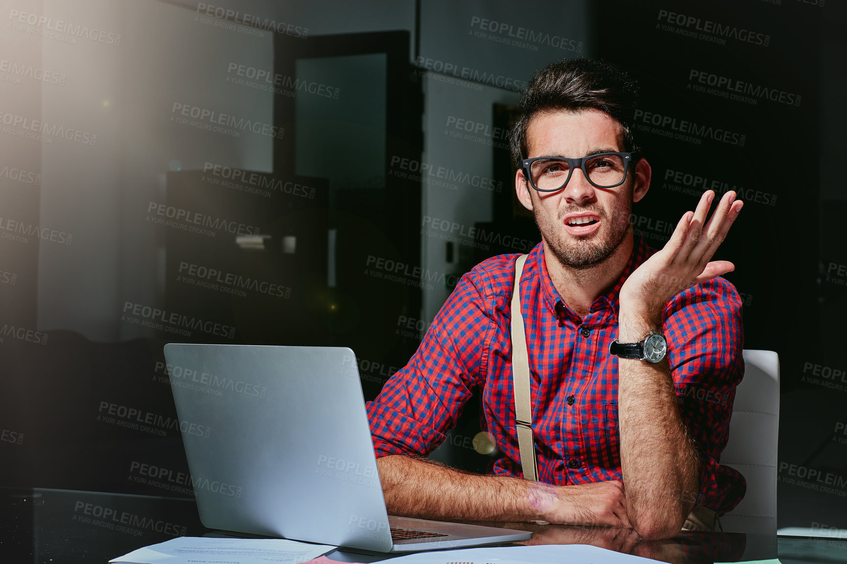 Buy stock photo Cropped portrait of a frustrated young designer looking lost while working on his laptop