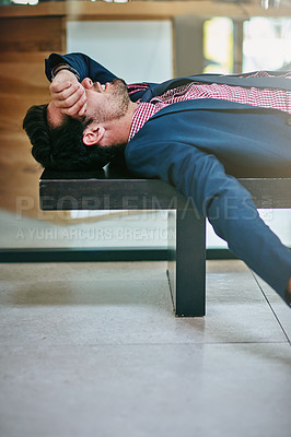 Buy stock photo Shot of a tired businessman taking a break to rest in the office