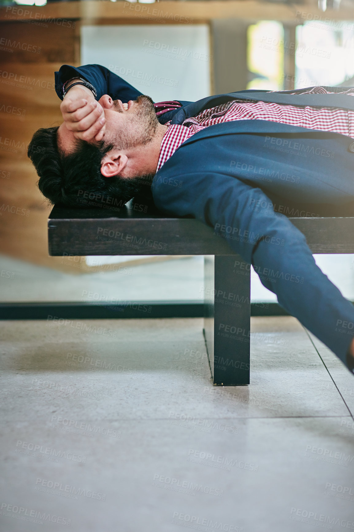 Buy stock photo Shot of a tired businessman taking a break to rest in the office