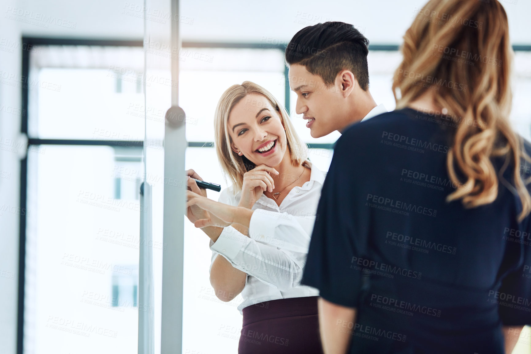 Buy stock photo Cropped shot of three businesspeople working together in the office