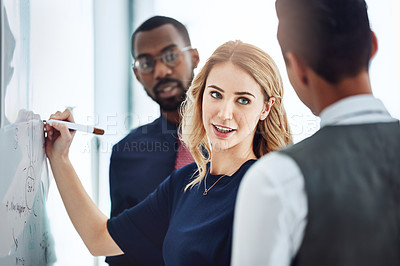 Buy stock photo Cropped shot of three businesspeople working together in the office