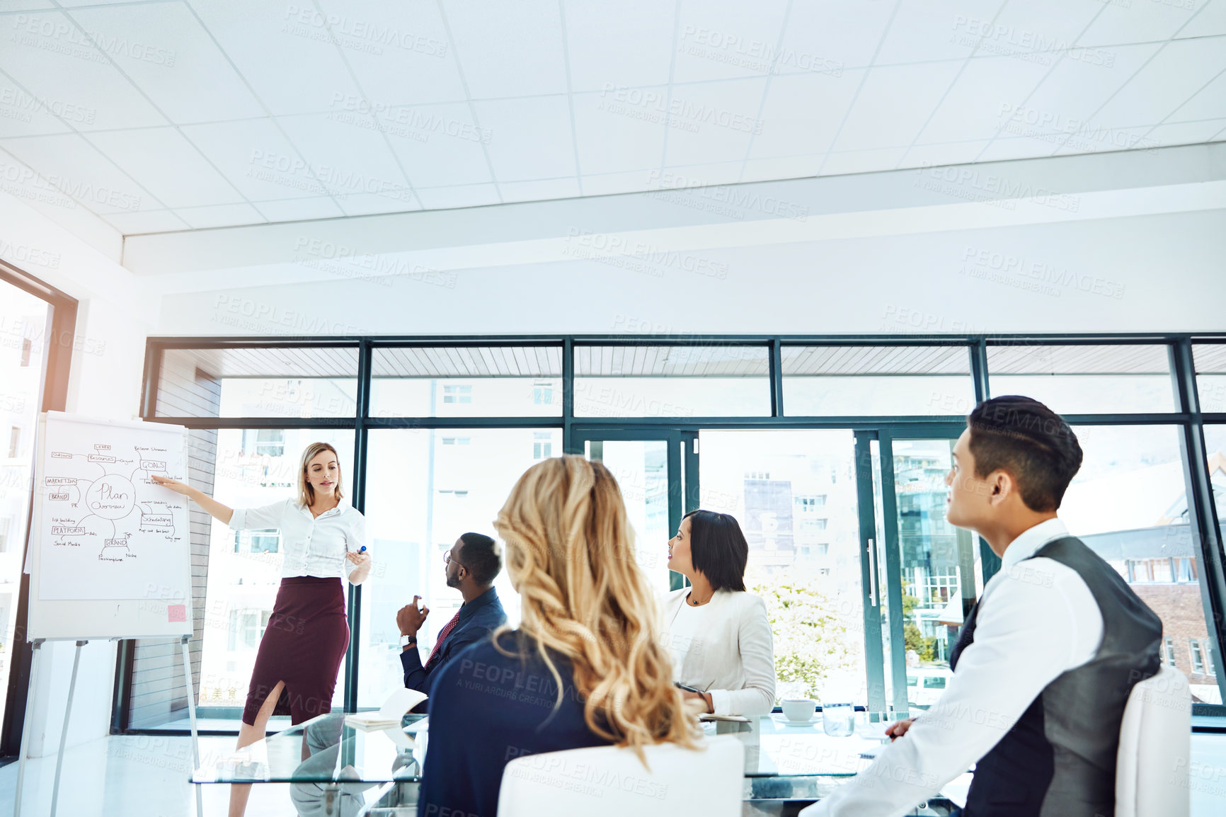 Buy stock photo Cropped shot of a young businesswoman giving a presentation in the boardroom