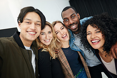 Buy stock photo Portrait of a group of happy and diverse young colleagues working together in a modern office