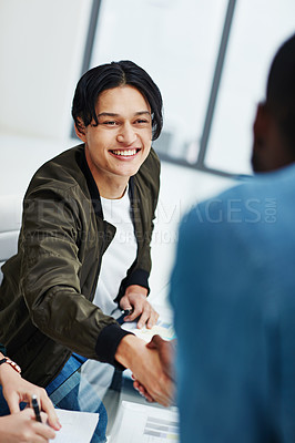 Buy stock photo Shot of colleagues shaking hands during a brainstorming session at work