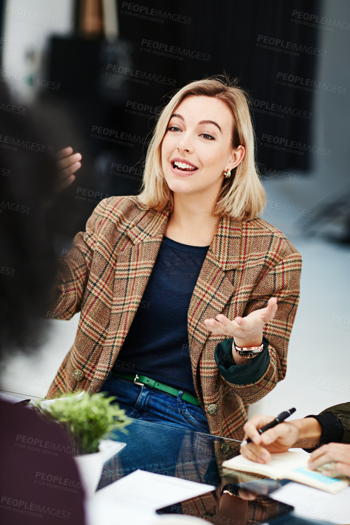 Buy stock photo Confident, trendy and smiling businesswoman talking in meeting sharing her creative marketing ideas. Stylish team leader having a friendly staff discussion about project plans and job task management