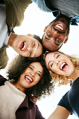 Buy stock photo Portrait of a group of happy people huddled together in solidarity