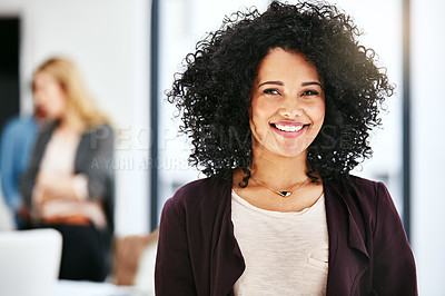 Buy stock photo Closeup portrait of a happy, successful and confident business woman standing in a office. Beautiful African American female smiling, with her colleagues in the blurred copyspace background.