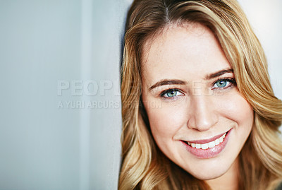 Buy stock photo Beautiful, young and smiling female face looking happy and confident with copyspace. Closeup of a blonde natural beauty with perfect teeth and skin. Portrait of a happy, content woman alone 