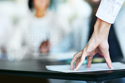 Buy stock photo Business person touching report, paper or document while in a meeting, seminar or training at work. Hand of a confident manager, leader or boss doing a presentation in a workshop or conference