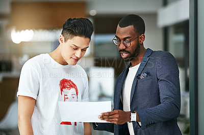 Buy stock photo Manager, leader or mentor talking to an intern, employee and training while giving feedback on a document. Business man discussing ideas and strategy with his junior marketing assistant at work