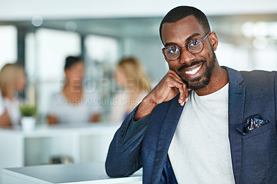 Buy stock photo Confident, happy and smiling creative man standing in the office with a team of marketing agents in background. Portrait of cheerful, motivated and proud designer ready for success in startup company