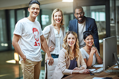 Buy stock photo Portrait of a group of colleagues using a computer together in a modern office