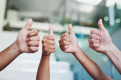 Buy stock photo Cropped shot of a group of hands showing thumbs up in an office