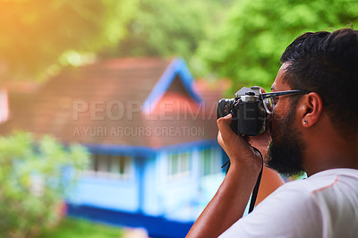 Buy stock photo Shot of an unidentifiable tourist taking a picture from his balcony