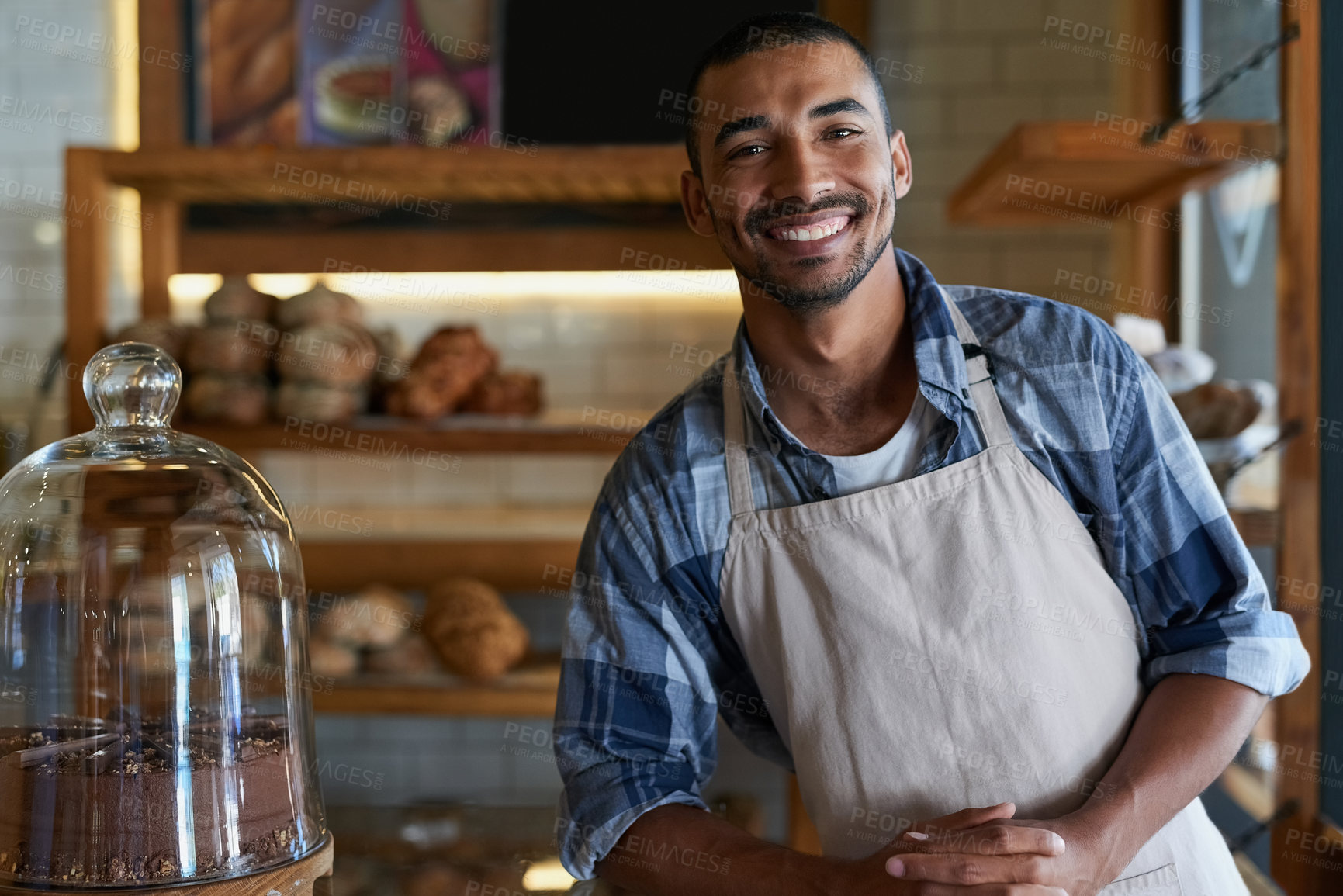 Buy stock photo Bakery, cafe and male owner for business, portrait and smile for small scale restaurant and service. Kitchen, pastry and baker for entrepreneur in hospitality, shop and male person for food industry