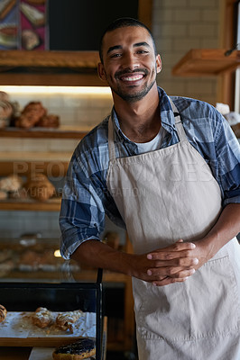 Buy stock photo Portrait of a young business owner standing in his bakery
