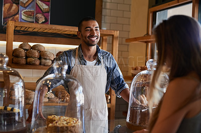 Buy stock photo Cropped shot of a shop assistant serving a customer in a bakery