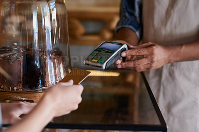 Buy stock photo Closeup shot of a customer making a credit card payment in a cafe