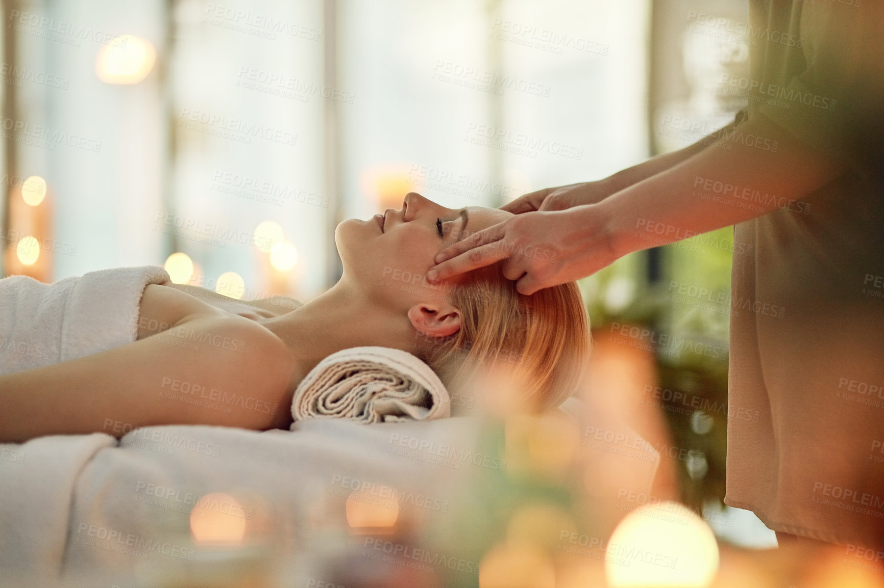Buy stock photo Cropped shot of a young woman enjoying a head massage at a spa