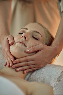 Buy stock photo Closeup shot of a young woman enjoying a massage at a spa