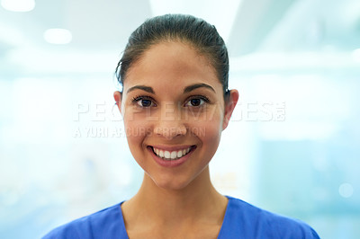 Buy stock photo Portrait of a confident young nurse smiling in the clinic