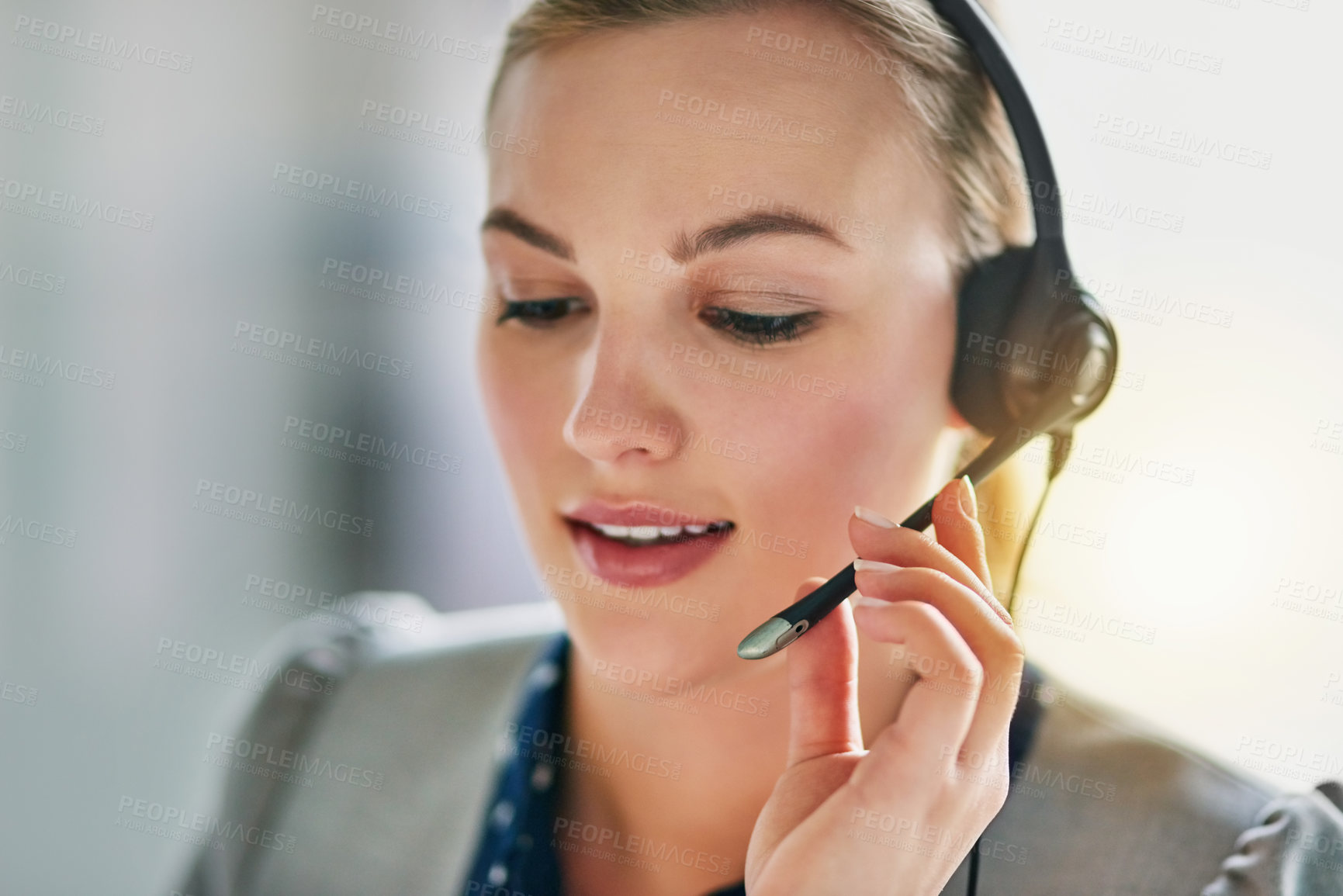 Buy stock photo Shot of an attractive young woman wearing a headset in the office